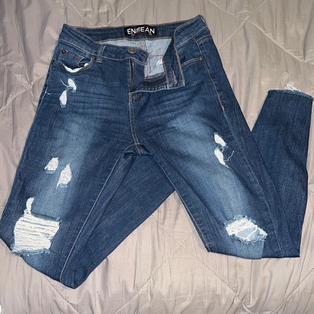 Faded dark blue ripped jeans